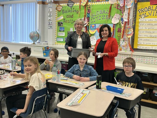 Trina Boymook, EIPS Board Chair, and the Honourable Adriana LaGrange, Education Minister, distribute snacks to A.L Horton Elementary students as part of the new nutrition program.