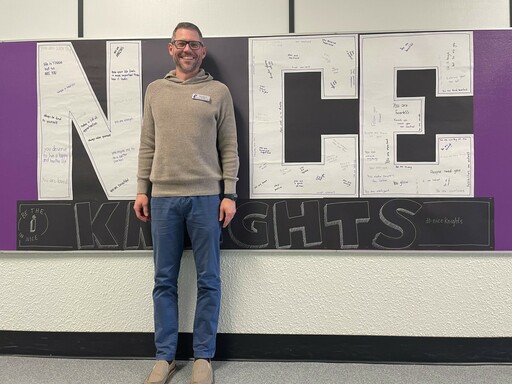 Matt Shudra, Principal at Clover Bar Junior High, stands beside the school's Bullying Awareness and Prevention Week display: &quot;Be the 'I' in Nice&quot;