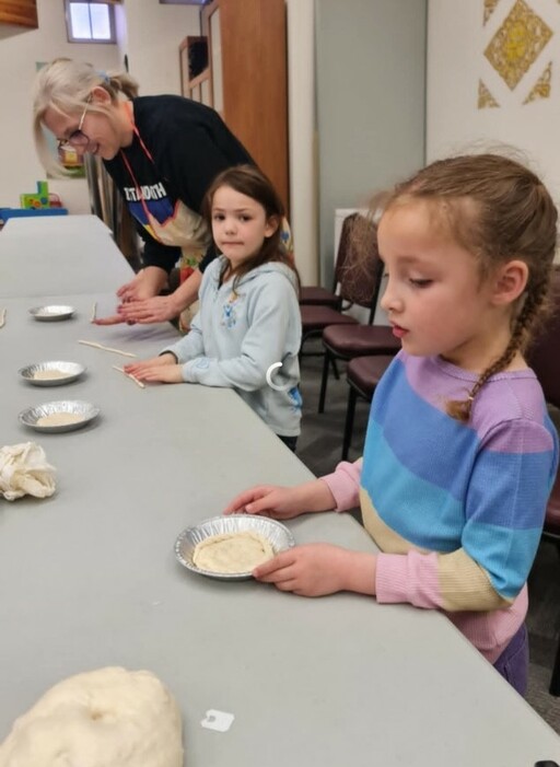 A.L. Horton Elementary students in the Ukrainian Language and Culture program create paska—a Ukrainian Easter bread typically decorated with braids and other designs.