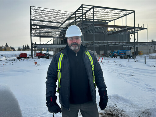 Ken Marshman, a project manager at EIPS, stands at the construction site for the newly named Forest Grove School.