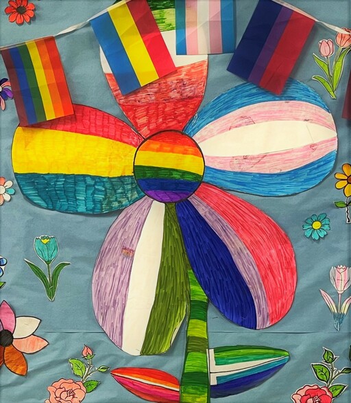 Flower art and LGBTQ2S+ flags displayed on SouthPointe School’s Pride bulletin board.