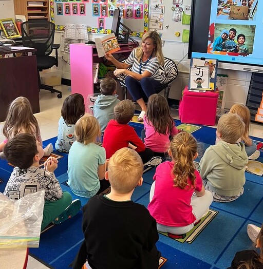 Tracy Beaudry, a secretary and registrar at Brentwood Elementary, reads aloud to students at the school during Read In Week 2024.