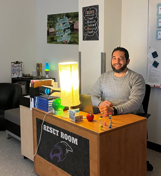 Richard Curbelo, a counsellor at Rudolph Hennig Junior High, welcomes students into the Reset Room at the school.