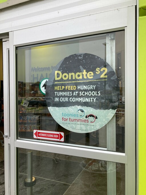 A door decal for the Toonies for Tummies campaign welcomes grocery store customers.